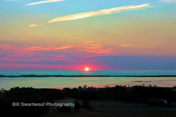 sunrise over little assawoman bay and the atlantic ocean